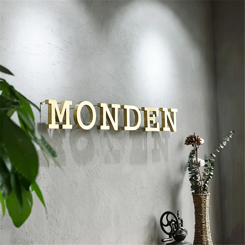 Kundenspezifisches LED-Buchstabenschild aus goldfarbenem, hochglanzpoliertem, gebürstetem Edelstahl mit hintergrundbeleuchtetem LED-Buchstabenschild, hinterbeleuchtetem Store-Business-Logo