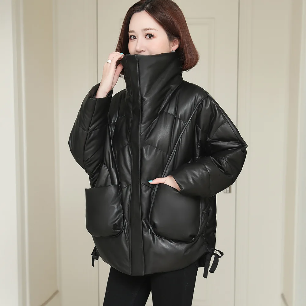 Chaqueta de plumón de cuero para mujer, cuello alto, ropa de abrigo de piel de oveja auténtica, ajuste relajado, abrigo negro informal con bolsillos, invierno