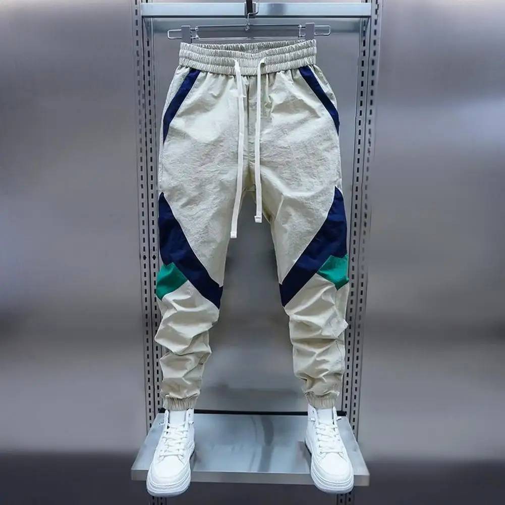 กางเกงคาร์โก้สําหรับผู้ชายหลายกระเป๋ายืด Joggers กางเกงสีกากีผู้ชายฮาเร็มหลายกระเป๋าผ้าฝ้ายฮาราจูกุขนาดใหญ่สไตล์เกาหลี