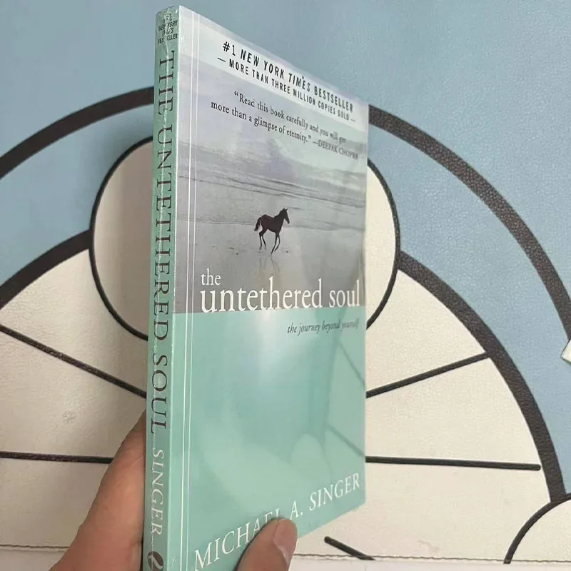 The Untethered Soul โดย Michael A. นักร้อง The Journey Beyond Yourself นวนิยาย # หนังสือปกอ่อนขายดีของ New York Times 1 เล่ม
