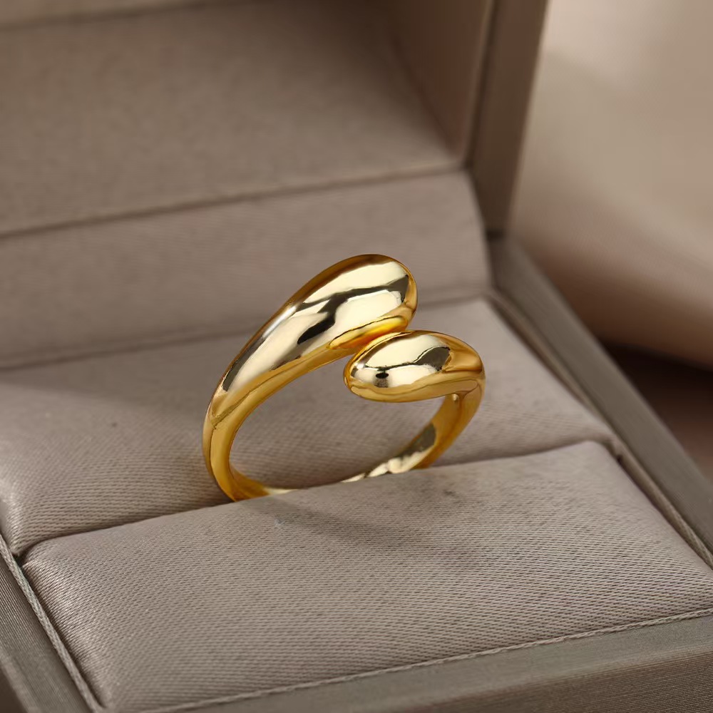 A ladies' stainless steel glossy double-ball open gold ring