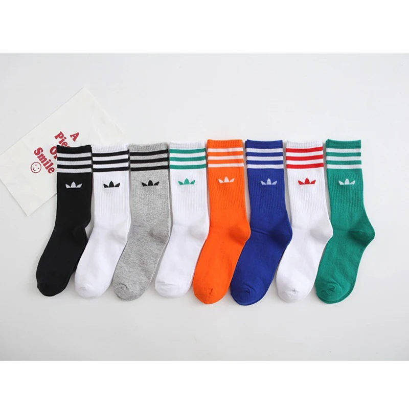 Calcetines deportivos puros a la moda de tubo de alto Color, calcetines de algodón con trébol para hombres y mujeres, calcetines Ins salvajes, calcetines a rayas, novedad de 2024