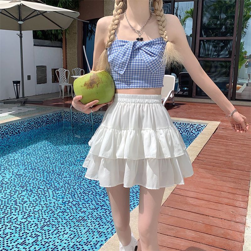 Falda plisada de línea a para mujer, falda blanca con volantes, estilo Preppy, elástica, cintura delgada, simple, venta al por mayor, Verano