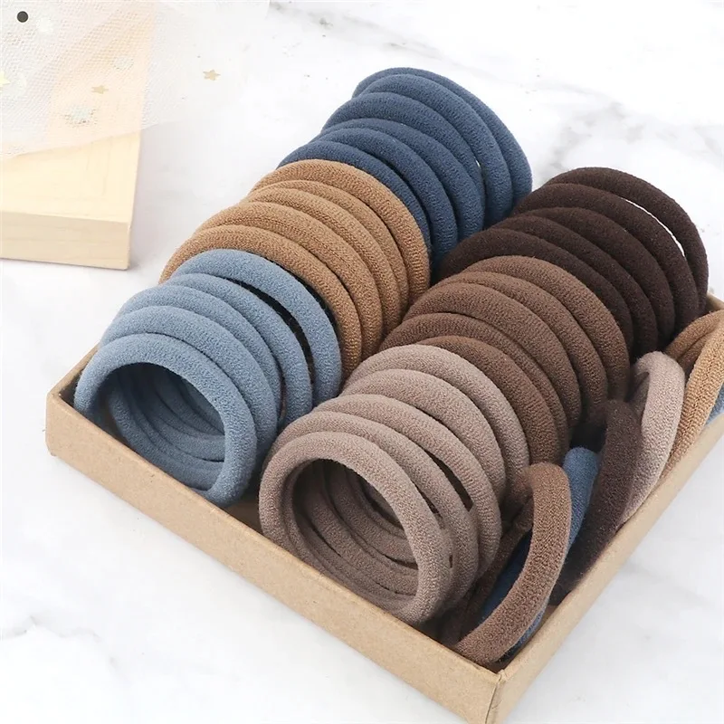 Muitas pessoas como a corda de cabelo de alta elasticidade 100 peças de várias cores corda de anel de cabelo sem costura.