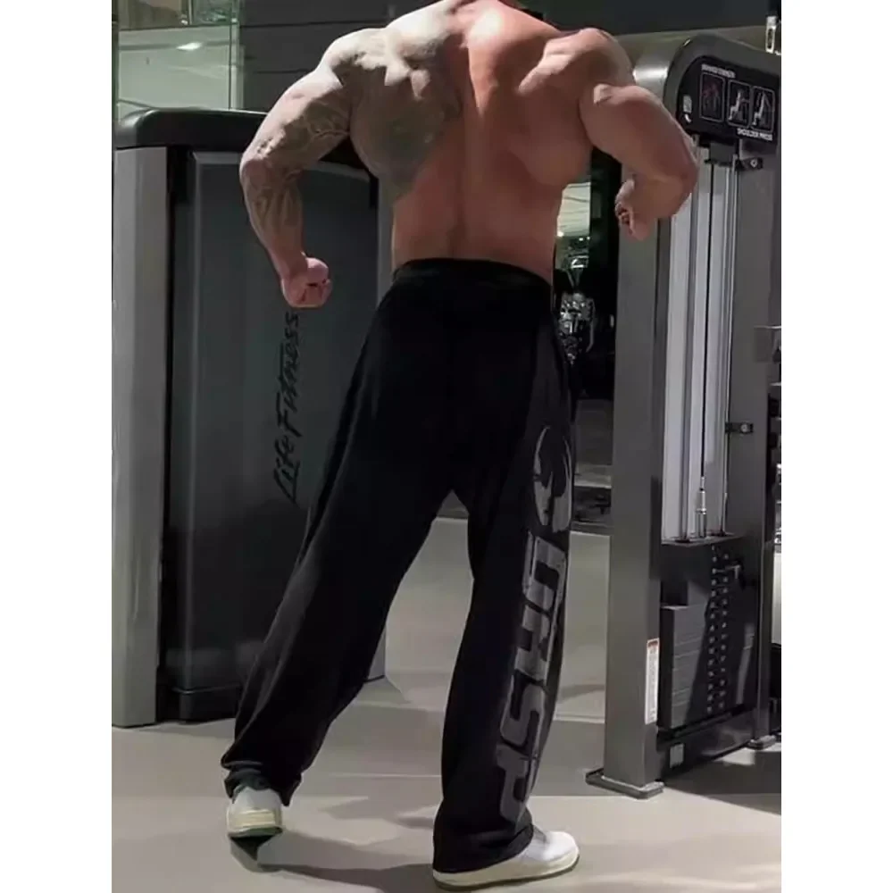 Calças de fitness muscular masculina algodão impressão solta tudo-em-um simples esporte correndo casual americano rendas calças de perna reta