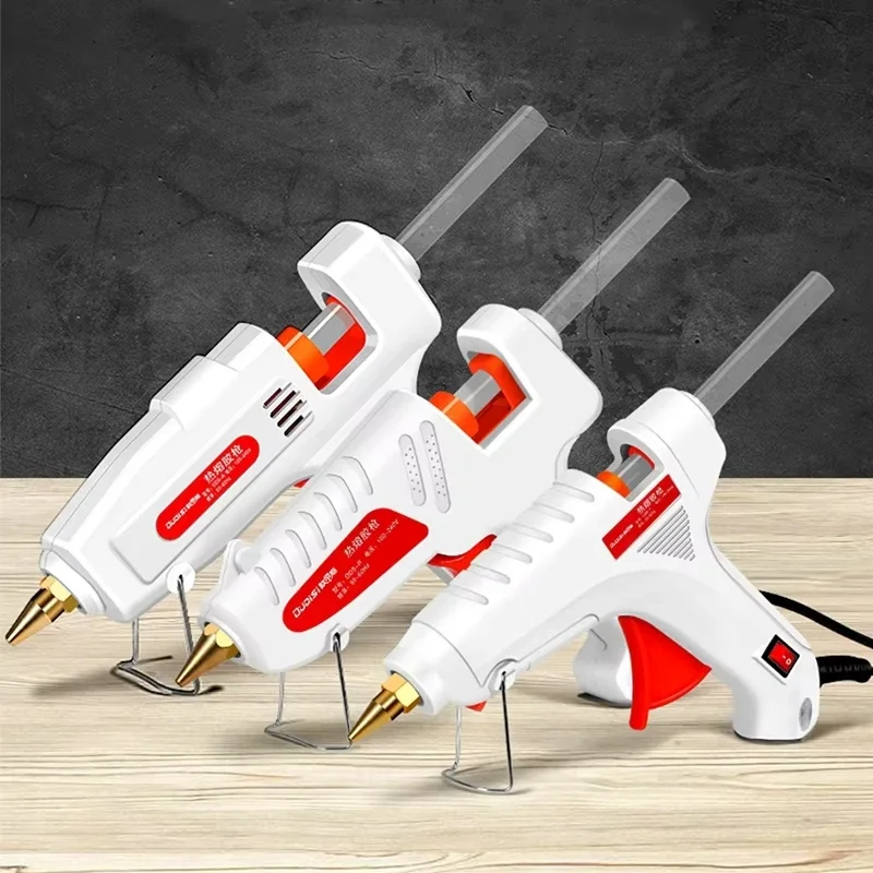 ปืนกาวร้อน 100W สำหรับงาน DIY ขนาดเล็ก เหมาะสำหรับใช้ในบ้านและอุตสาหกรรม เครื่องมือซ่อมไฟฟ้า ใช้กาวขนาด 11 มม. ปลั๊กแบบ US จัดส่งแบบสุ่มตามสไตล์
