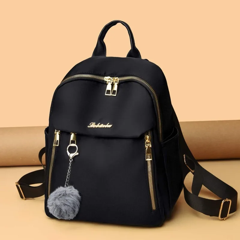 Bolsa casual elegante de nylon para mulheres, mochila de viagem leve, mochila moderna para estudantes universitários com alças duplas.