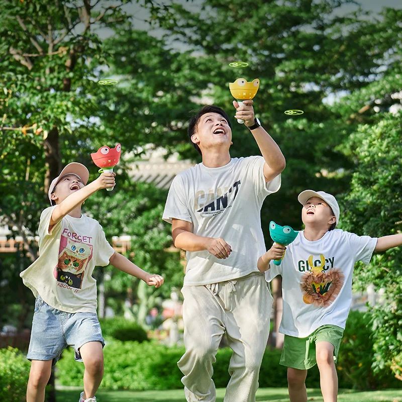 ดึง String Flying Saucer Disc Launcher เด็กของเล่นโยนจับกีฬากลางแจ้งใบพัดเด็กสวนเกมของขวัญ Boy