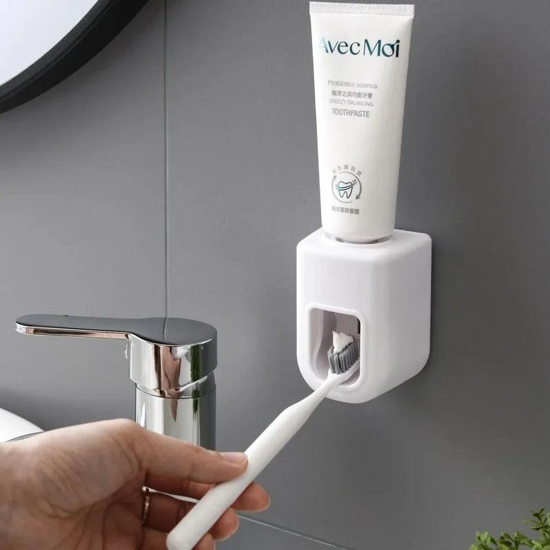 Creative Wall Mount เครื่องจ่ายยาสีฟันอัตโนมัติอุปกรณ์ห้องน้ํากันน้ําขี้เกียจยาสีฟัน Squeezer ผู้ถือแปรงสีฟัน