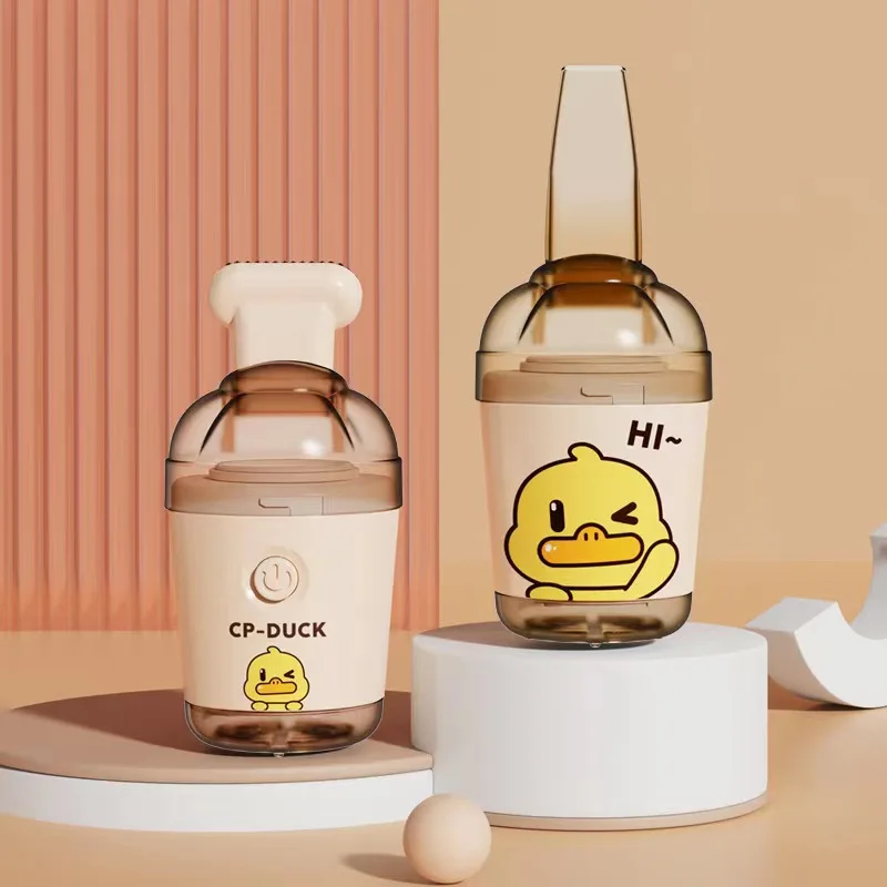 Aspirador de escritorio potente succión de escoria de goma pato amarillo limpiador de mano Mini aspirador para niños y estudiantes