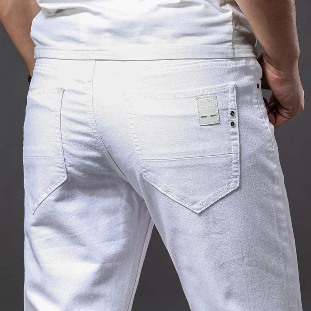 Pantalones vaqueros blancos elásticos rectos ajustados informales suaves de negocios pantalones de marca clásicos pantalones vaqueros elásticos avanzados de moda