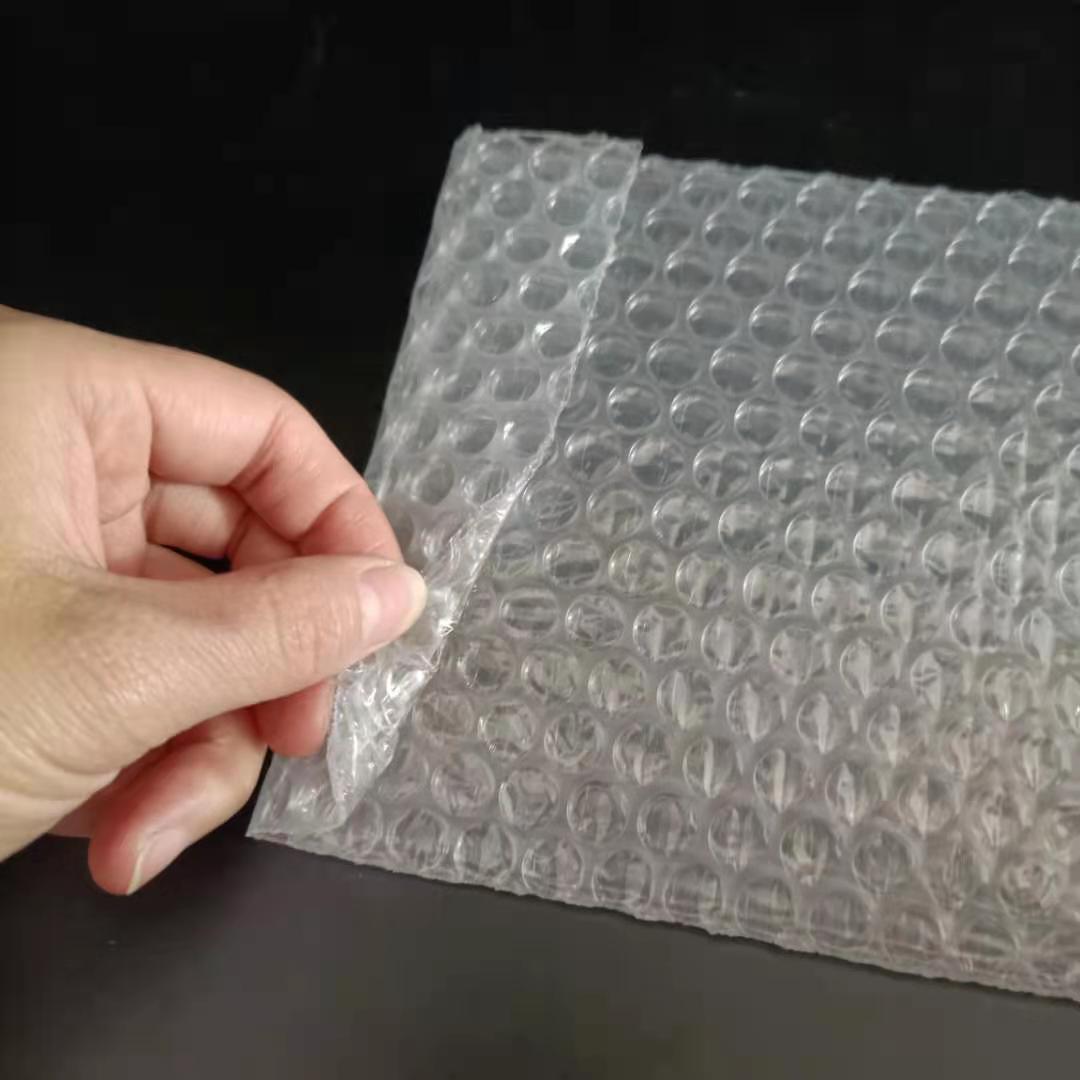 Envoltura de plástico autosellante, bolsas de embalaje de burbujas transparentes de PE, bolsa de embalaje transparente a prueba de golpes, bolsa de burbujas de doble película