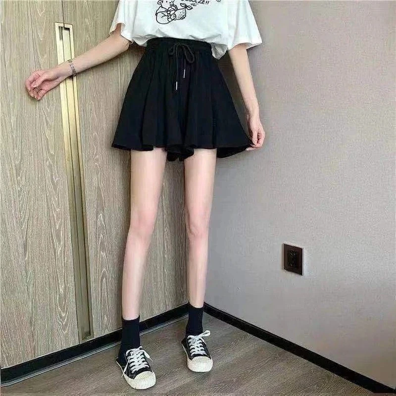 Faldas cortas de verano 5XL para mujer, pantalones cortos de pierna ancha informales elásticos de cintura alta, minifalda holgada de línea A coreana, pantalones cortos negros