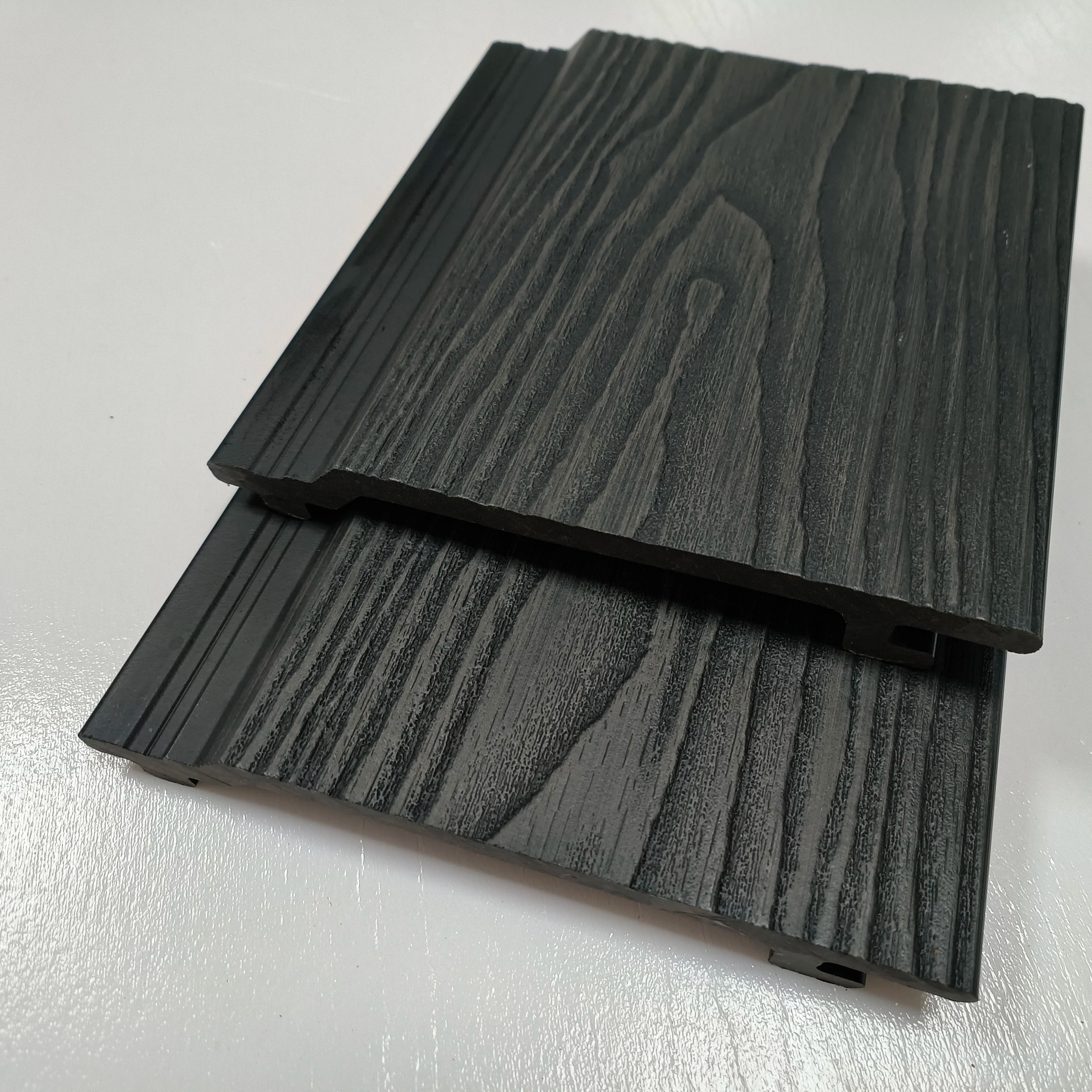 Revestimiento de pared de Wpc exterior de Color nogal para cubierta de pared exterior Panel de grano de madera 3D compuesto de plástico de madera