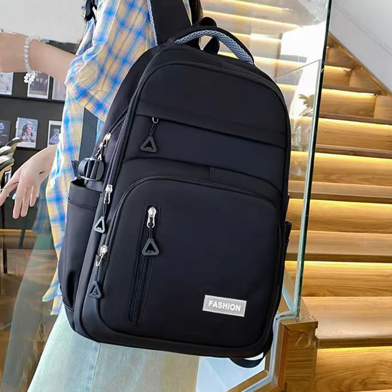 Mochilas de doble hombro para hombre y mujer de color liso con múltiples compartimentos, adecuadas para estudiantes.