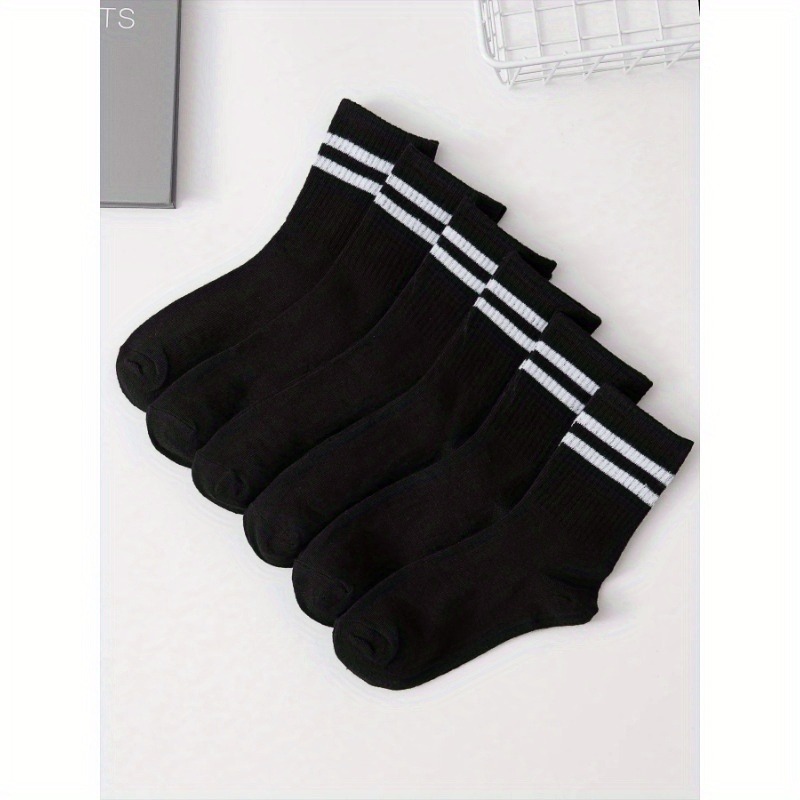 Juego de 6 pares de medias de tubo alto de longitud media para hombres en blanco y negro sólido con barras paralelas populares y absorción del sudor