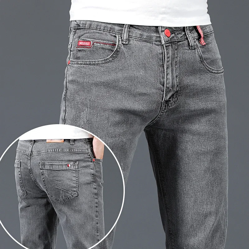 2024 nuevos pantalones vaqueros ajustados informales de negocios de algodón para hombres pantalones vaqueros ajustados rectos elásticos a la moda para hombre azul gris