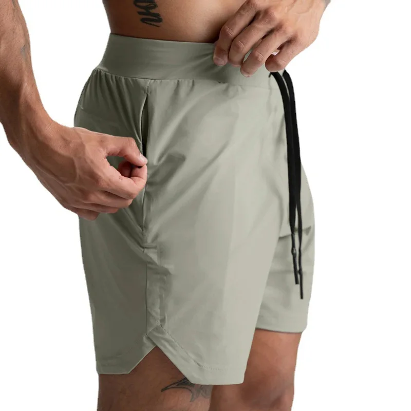 Calções de tecido único shorts de secagem rápida cor sólida correndo fitness esportes casual estilo americano calças de cinco quartos para homem