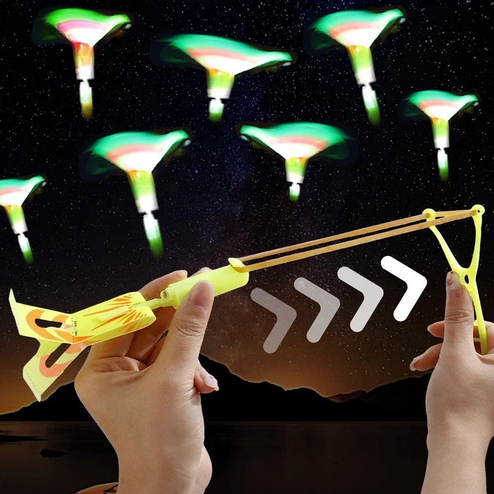 Lotes apito redondo espada voadora brinquedos led azul/flash borracha estilingue catapulta brinquedo das crianças mini máquina voadora brinquedo presentes