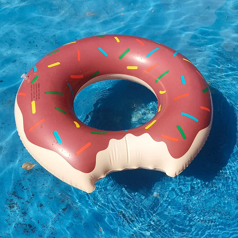 A thickened inflatable donut swimming ring - brown/pink printed - a floating ring for maximum comfort and fun