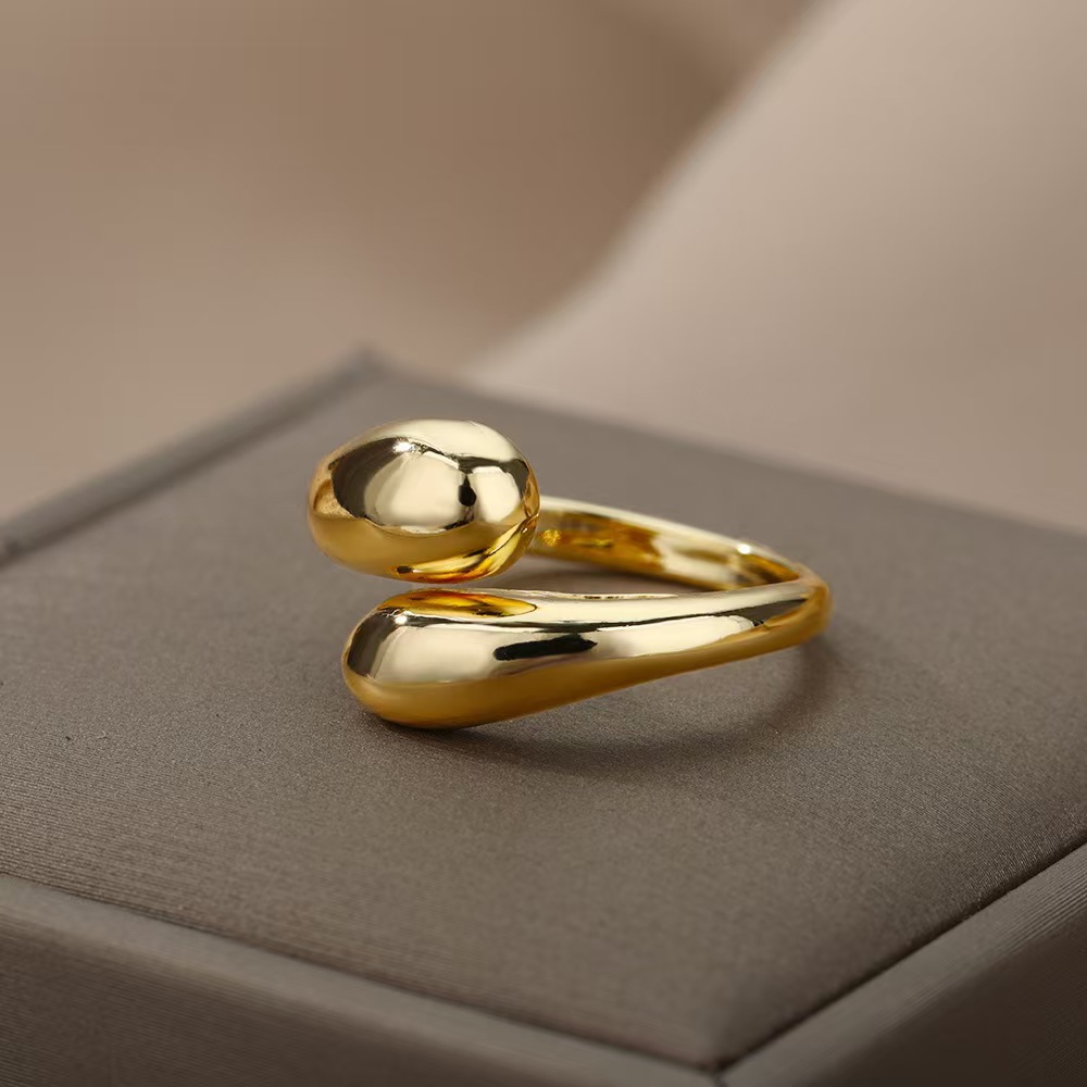 A ladies' stainless steel glossy double-ball open gold ring
