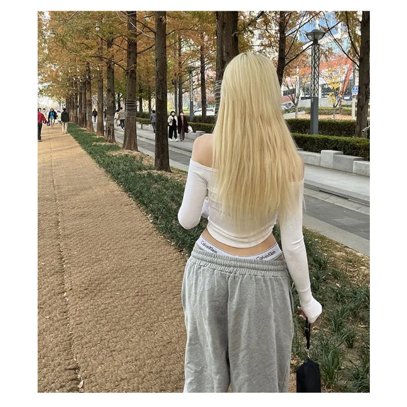 Camiseta Sexy con cuello oblicuo para mujer, Camiseta recortada de algodón de manga larga, camiseta ajustada para mujer, Tops blancos y negros 2024