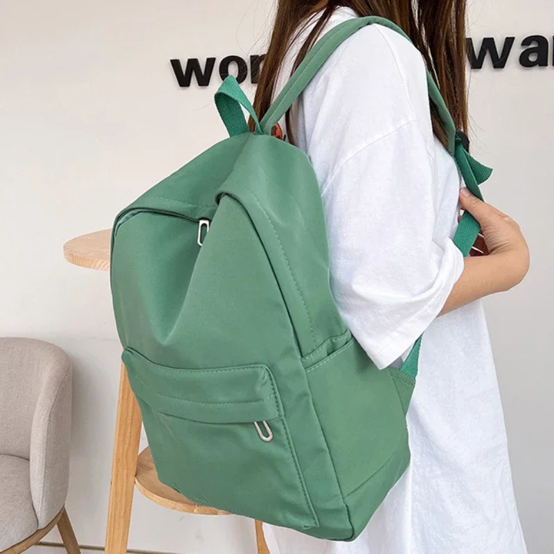 Nueva mochila escolar de nailon resistente al agua de alta calidad para mujeres adolescentes, bolsa de viaje para mujeres, mochila de Color sólido para estudiantes
