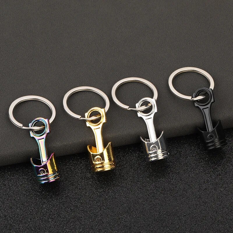 Charmant hommes et femmes voiture sac porte-clés porte-clés en métal en forme de piston de voiture avec pendentif