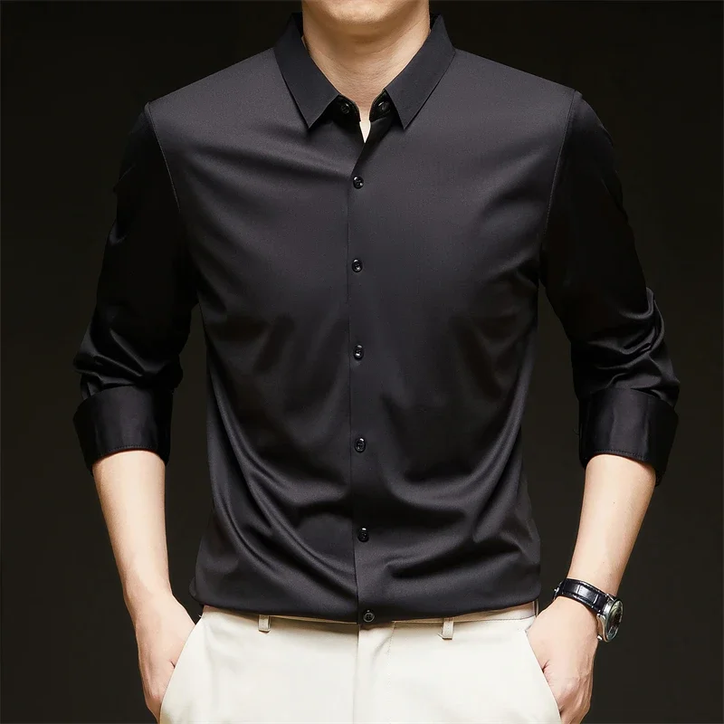 Nueva camisa informal de negocios de manga larga de Color sólido para hombre, resistente a las arrugas, cómoda, versátil para todas las estaciones