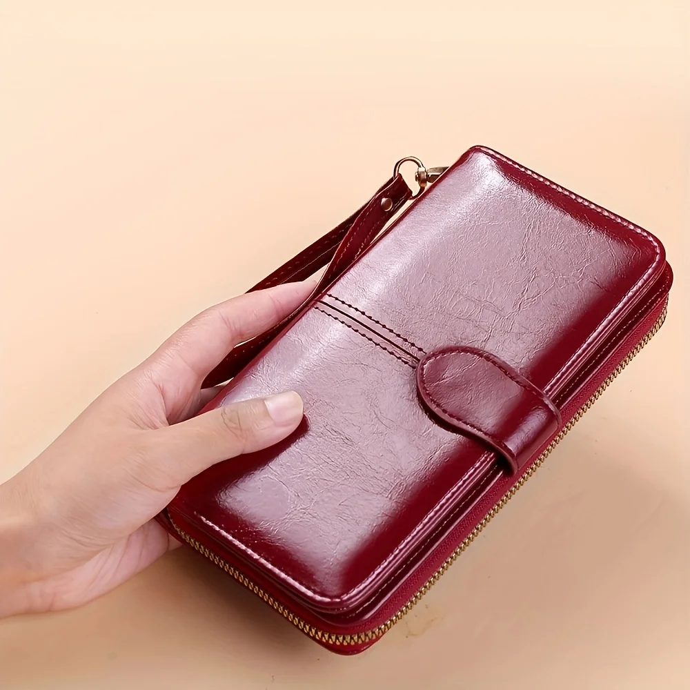 Bright and shiny wax leather long wallet that can hold multiple cards, card bags, and comes with a wristband
