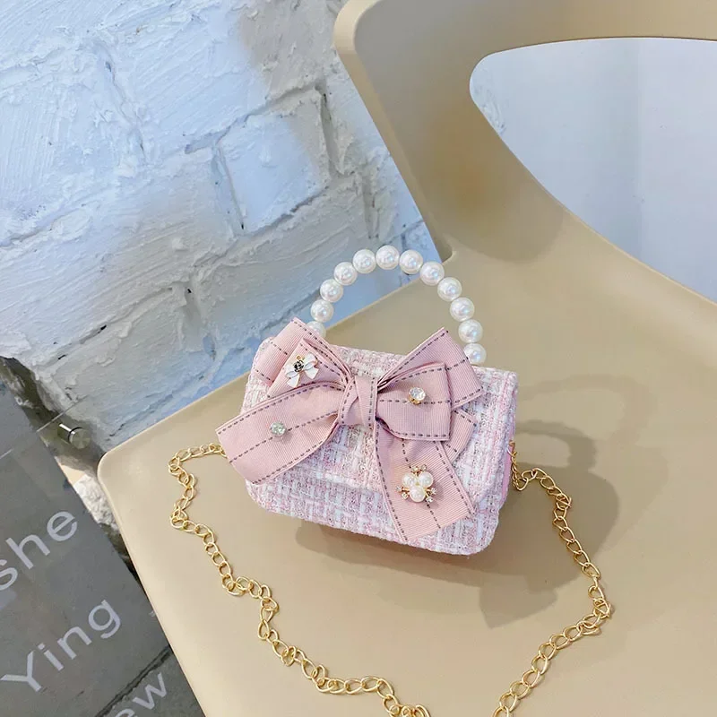 Bolsa de corrente estilo princesa Chanel para crianças, acessórios pérola bebê, bolsa sino de mão, arco bonito, bolsa ombro menina, moda