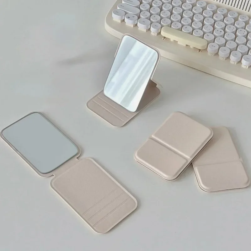 Specchio per il trucco da tavolo Specchio per il trucco portatile semplice in pelle PU tinta unita Specchio tascabile carino compatto per studenti pieghevole