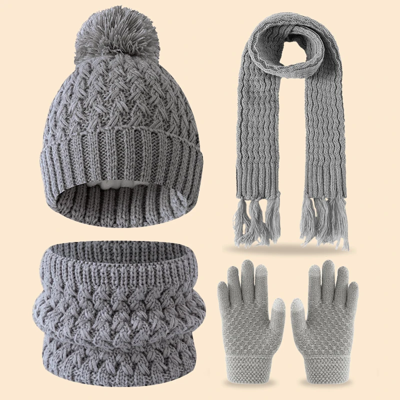 Un simpatico pile invernale a una sola palla e un set addensato di sciarpe, cappelli e guanti con nappe per bambini di 3-14 anni