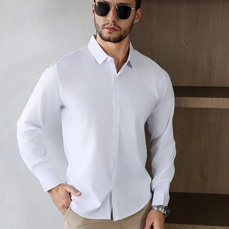 Nueva camisa informal de negocios de manga larga de Color sólido para hombre, resistente a las arrugas, cómoda, versátil para todas las estaciones