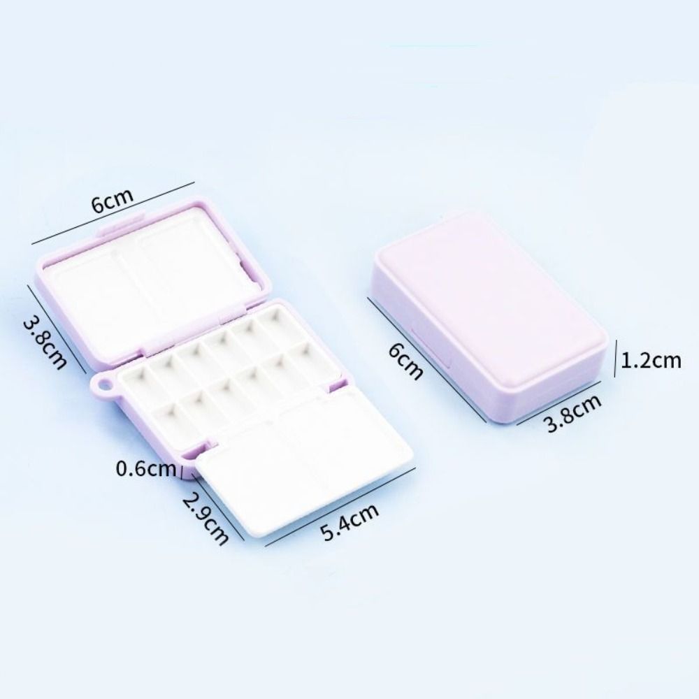 Mini caja de pintura de plástico portátil de viaje de alta calidad, caja de pigmento de paleta de subpaquete de pintura de acuarela púrpura de 12 rejillas