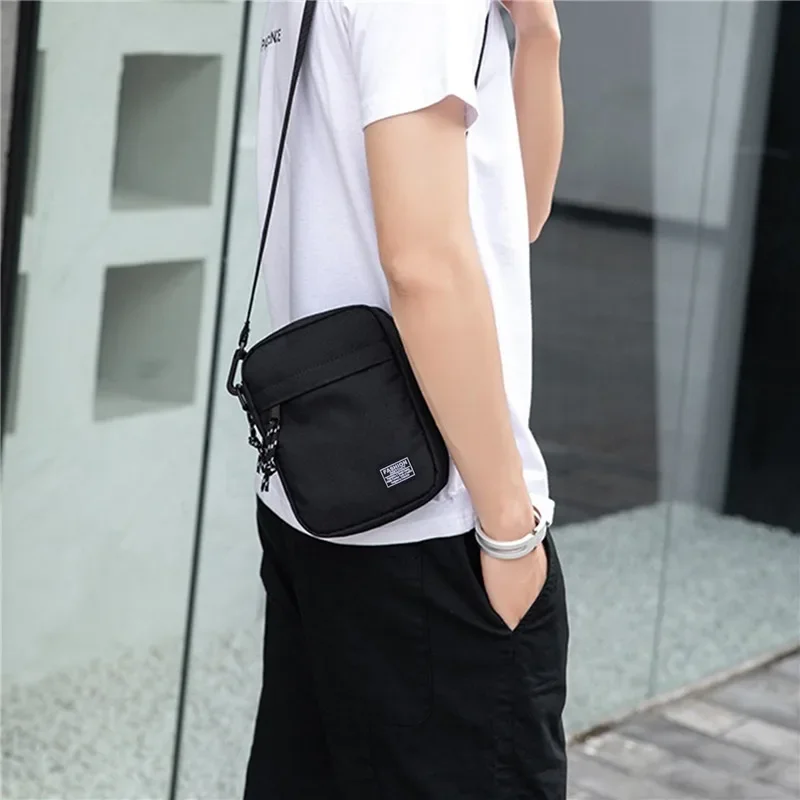 กระเป๋าสะพายผ้า Oxford Casual Men's Satchel กระเป๋าสี่เหลี่ยมเล็กแฟชั่น Diagonal Crossover Hand Machine กระเป๋าถือผู้หญิงกระเป๋าเดินทาง