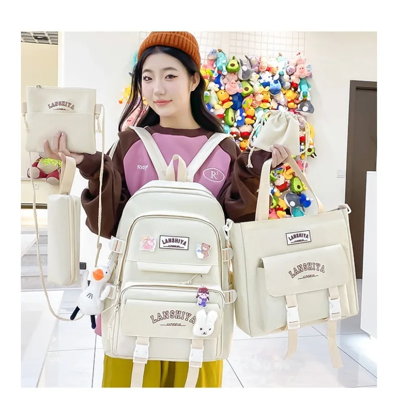 ชุดจี้ฟรี 5 ชิ้นสไตล์ป่าเวอร์ชั่นเกาหลีลําลองฮาราจูกุกระเป๋าเป้สะพายหลังนักเรียนสําหรับสาวโรงเรียนมัธยมความจุขนาดใหญ่