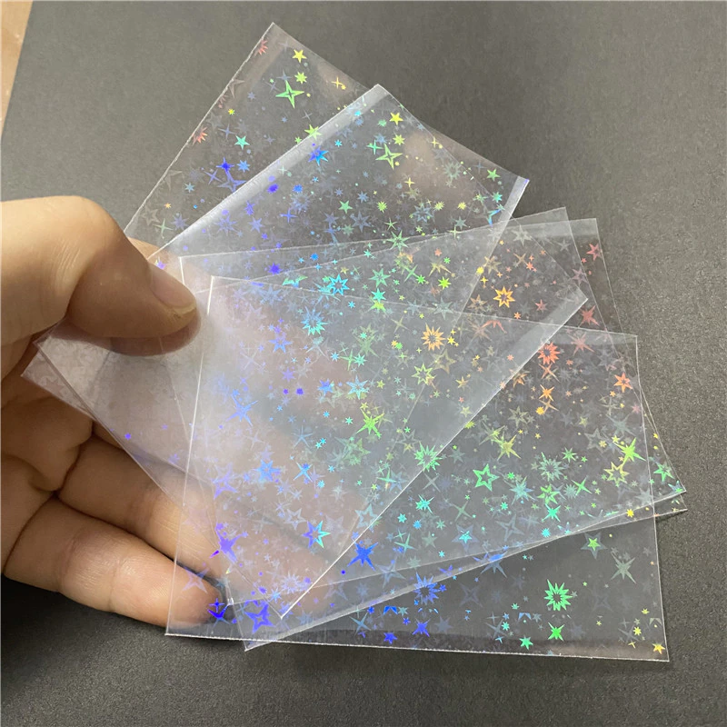 50PCS 58x87 มม.เลเซอร์ดาวหัวใจสายรุ้งผีเสื้อดอกไม้ไฟเกม Idol การ์ด Protector Holographic CLEAR การ์ดฟิล์มแขน