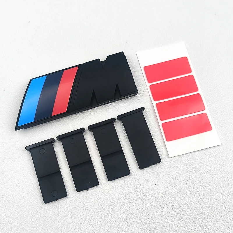 3D ABS สีดําโลโก้ M สัญลักษณ์รถย่างด้านหน้า Badge สําหรับ BMW X1 X2 X3 X4 X5 X6 F10 F30 F48 F39 E83 E84 E46 E60 G01 G07 G60 G11 G86