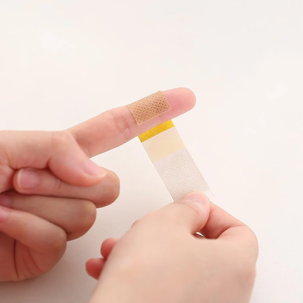 50pcs กันน้ําบาดแผลแพทช์เทป Self-Adhesive พลาสเตอร์ผ้าพันแผลผ้าไม่ทอ Band Aid สําหรับเด็ก