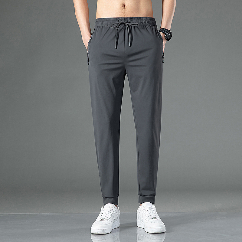 Pantalones de pierna ancha de pierna recta grande informales de seda de hielo de verano para jóvenes pantalones casuales sueltos deportivos de secado rápido con sensación de caída