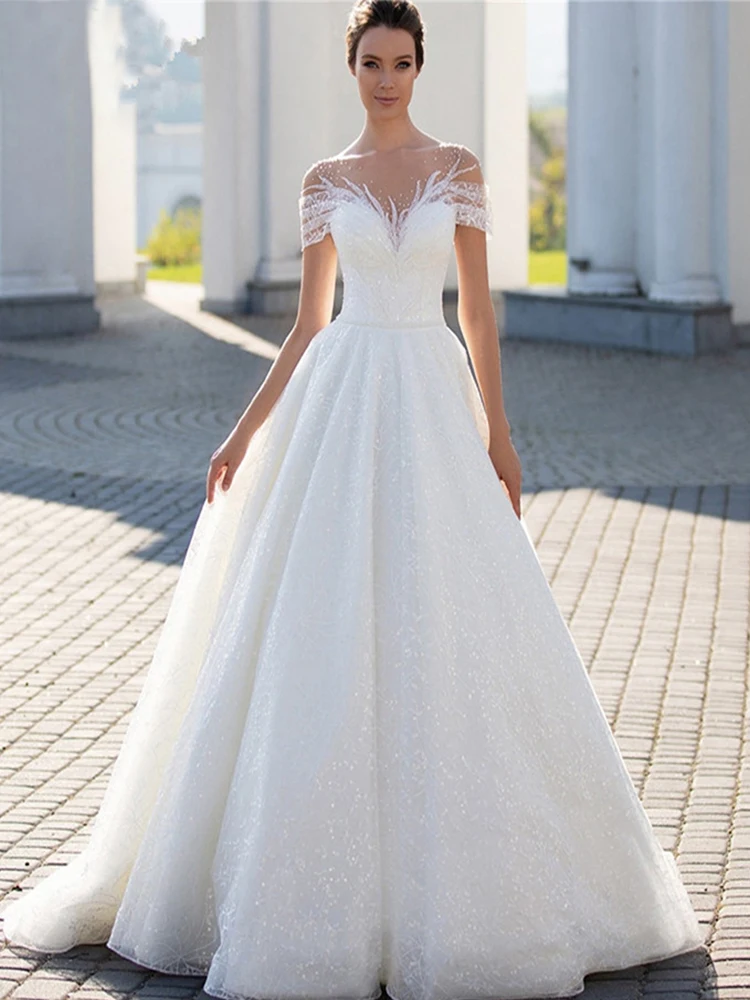 Abiti da sposa trasparenti con scollo a O per la sposa Elegante glitter Perals Pizzo A-Line Abito da sposa Illusion Pieghe Robe De Mariée