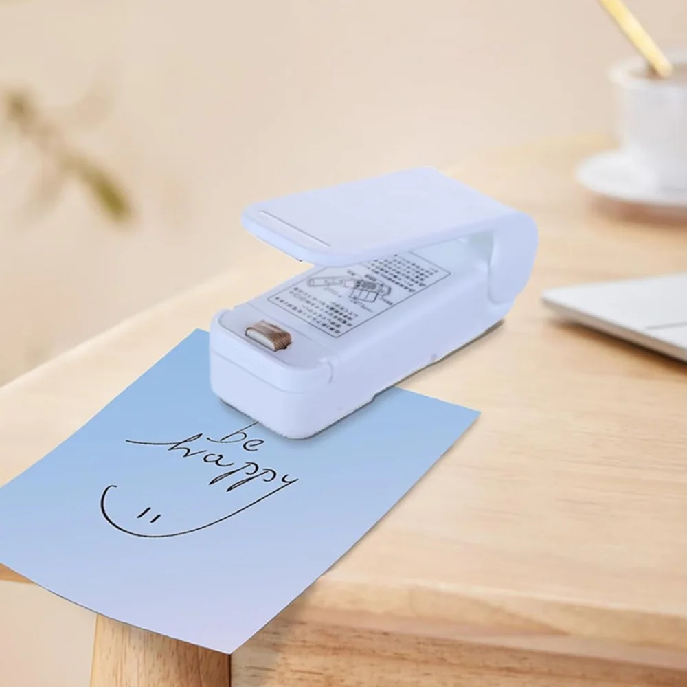 MINI บรรจุภัณฑ์ซีลถุงพลาสติกแบบพกพาคลิปเครื่องซีลเก็บอาหารซีลขนมขบเคี้ยวซีล Gadgets ครัวในครัวเรือน