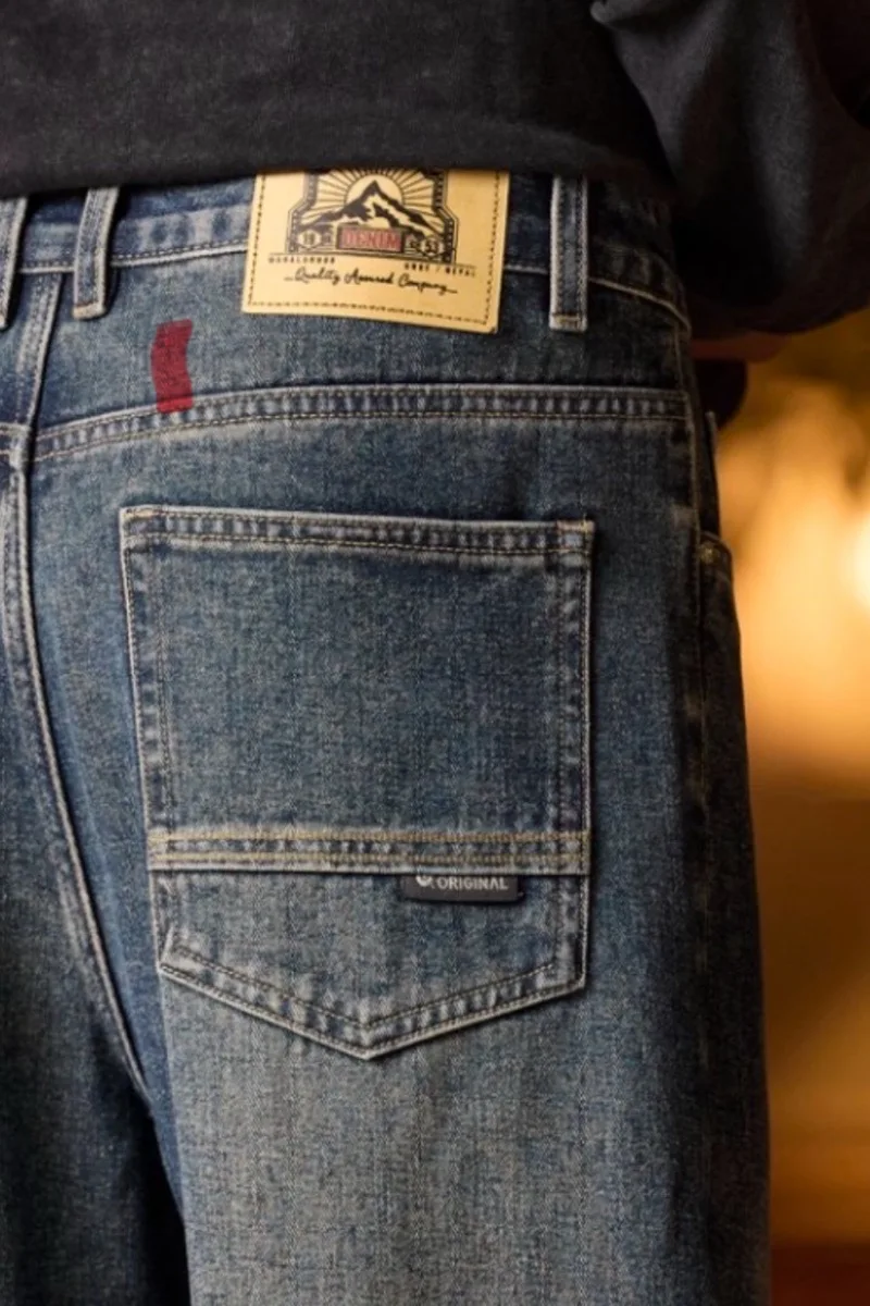 Vaqueros de cintura elástica para hombre Vaqueros azules de corte relajado con cintura elástica con cremallera y botón