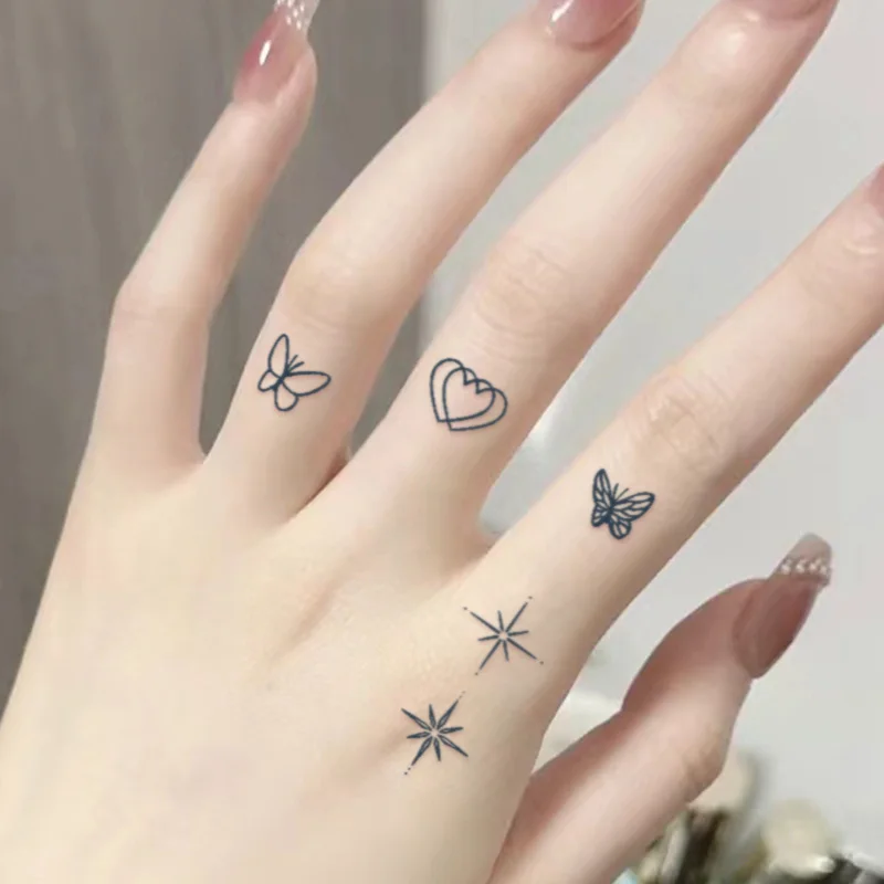 Autocollants de tatouage temporaire imperméables à petits motifs, imperméables longue durée pour une à deux semaines, tatouages au doigt pour femmes.
