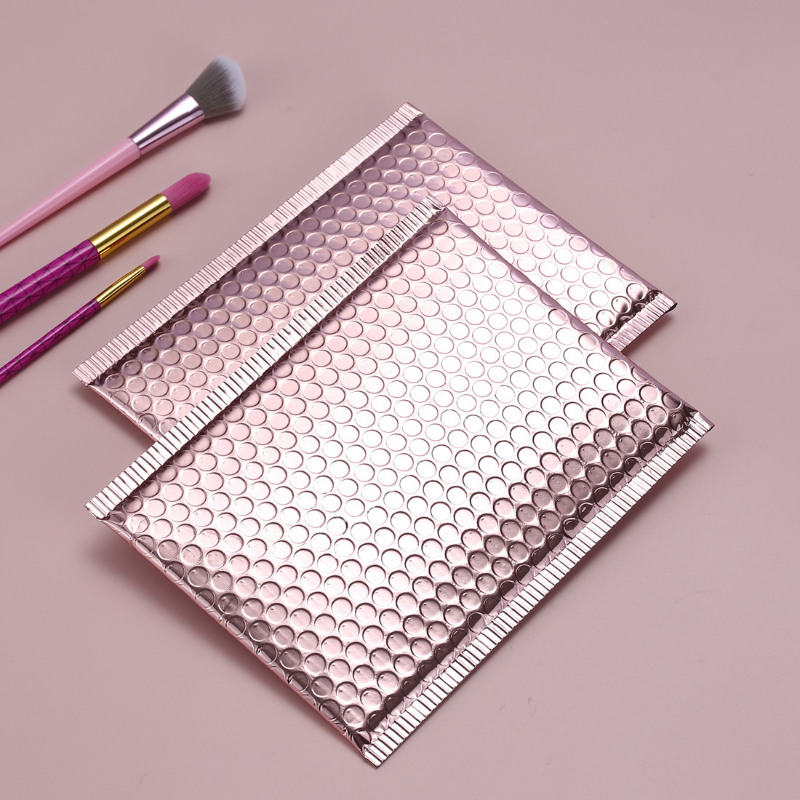 10 ピース/ロットローズゴールドメタリックバブルメーラー箔パッド入りバッグアルミメッキ郵便袋ギフト包装パッド入り配送封筒