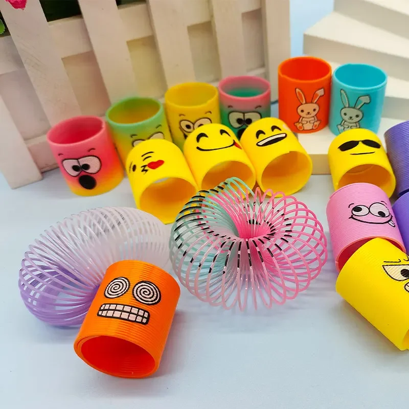 12pcs Rainbow Circle Funny Magic ของเล่นเด็กการศึกษา COIL วงกลมที่มีสีสัน Telescopic Elastic Magic แหวนเด็กของขวัญตลก