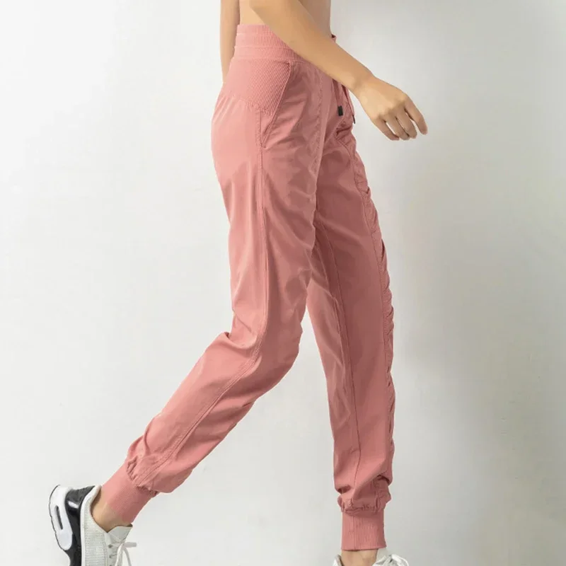 กางเกงวอร์มผ้า Drawstring วิ่งกีฬา Joggers ผู้หญิงด่วนแห้งแข็งแรงยิมฟิตเนสพร้อมกระเป๋าด้านข้างสองกางเกงออกกําลังกาย
