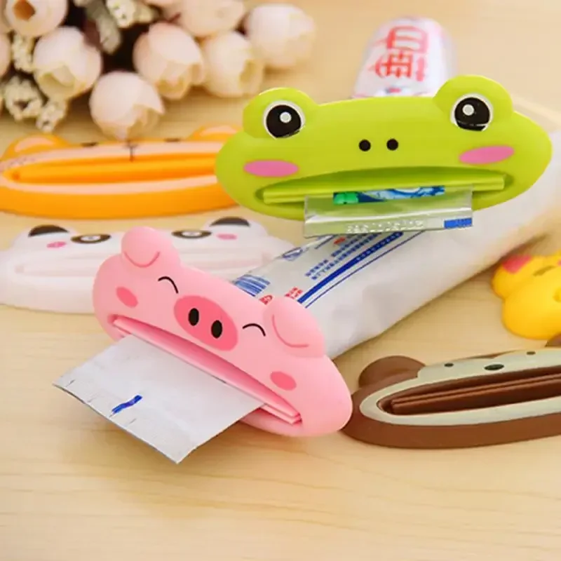 สําหรับห้องน้ํา 1 ชิ้นสัตว์ง่ายยาสีฟันพลาสติกฟันหลอดยาสีฟัน Squeezer Rolling ผู้ถือ Cocina