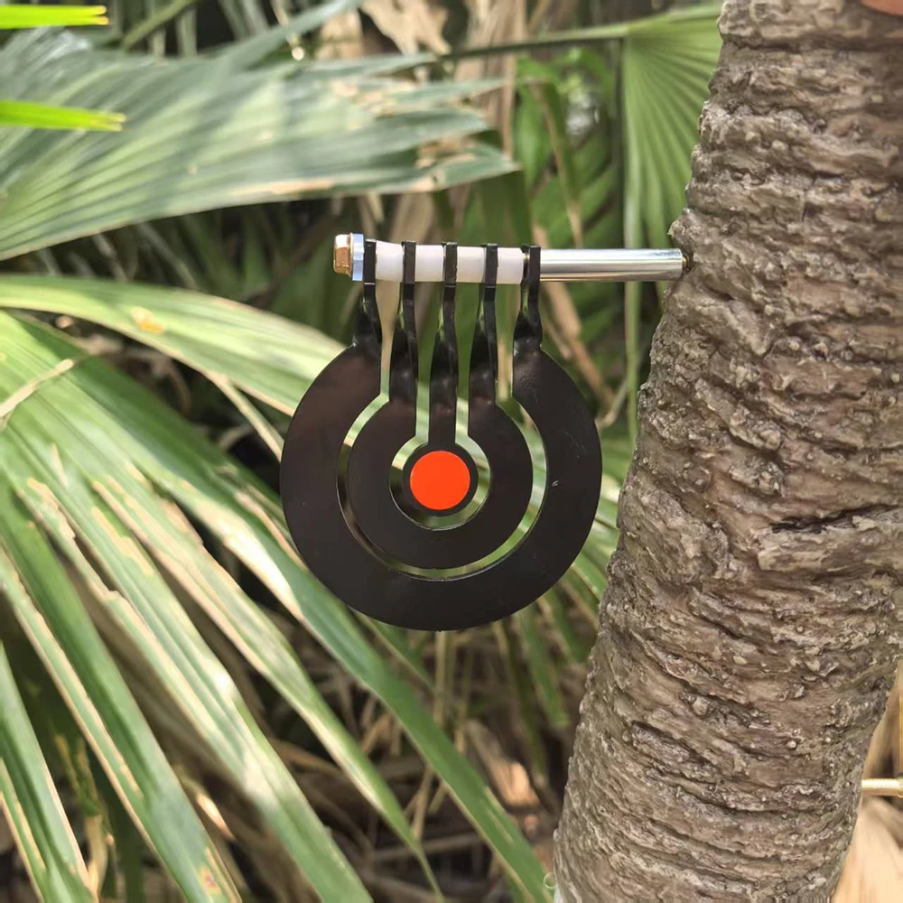 Shooting practice with a three - ring tree - inserted rotating pendulum target made of 3 - millimeter - thick metal